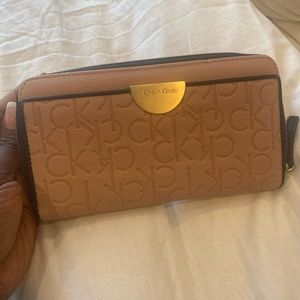 Leather blush pink with gold accents. Brand new